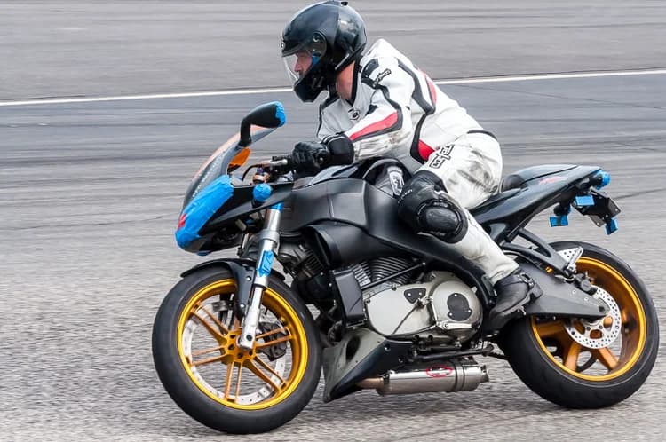 Sport motorcycle and rider during a track session