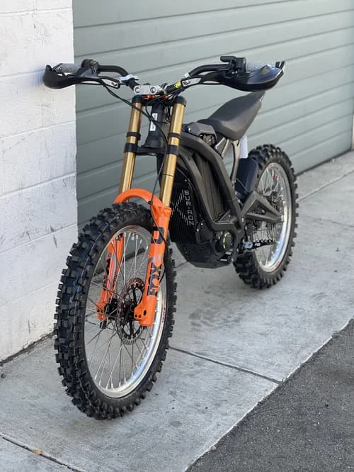 Off-road motorcycle parked outside the shop